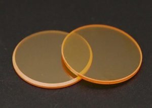 Zinc Selenide (ZnSe) Windows are ideal for a wide variety of infrared applications including thermal imaging, FLIR, and medical systems. This chemically vapor deposited material has wide usage in high power CO2 laser systems because of its low absorption coefficient and high resistance to thermal shock. Zinc Selenide (ZnSe) is a relatively soft material that scratches easily and it is not recommended in harsh environments because its Knoop Hardness is only 120. When handling, apply uniform pressure and wear Latex finger cots or gloves to prevent contamination.